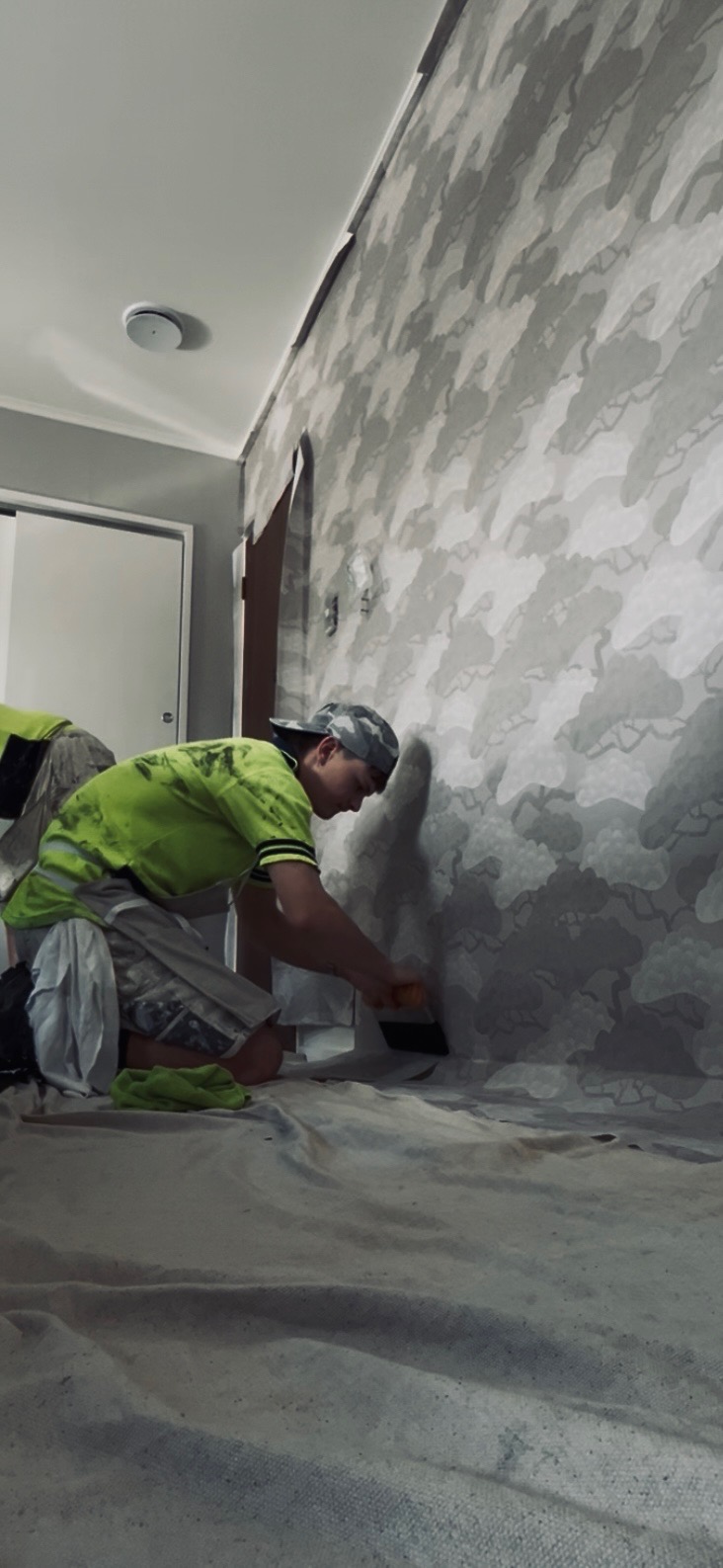 landscape bathroom with a freestanding tub and tiled wall